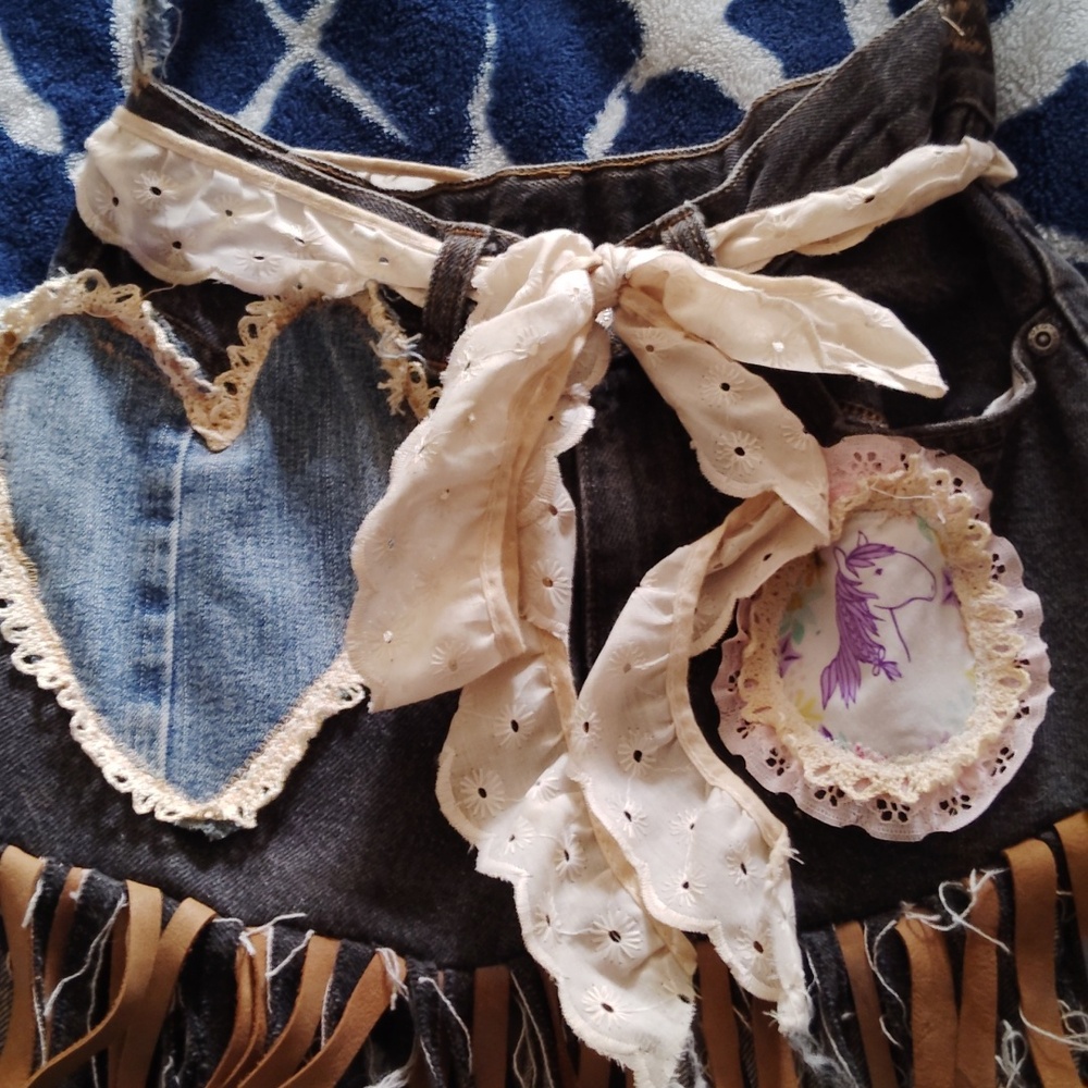Handmade upcycled jean fringe crossbody purse.